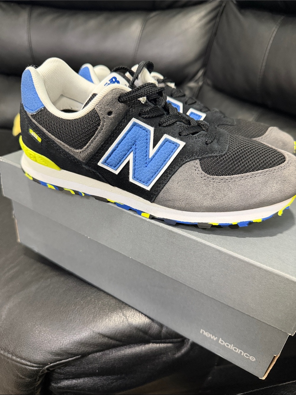 New Balance Kids Black, Gray & Blue Sneakers with Yellow Accent